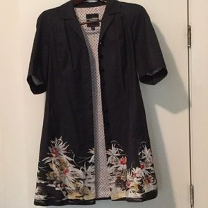 Lined, black, floral patterned, mid length coat.